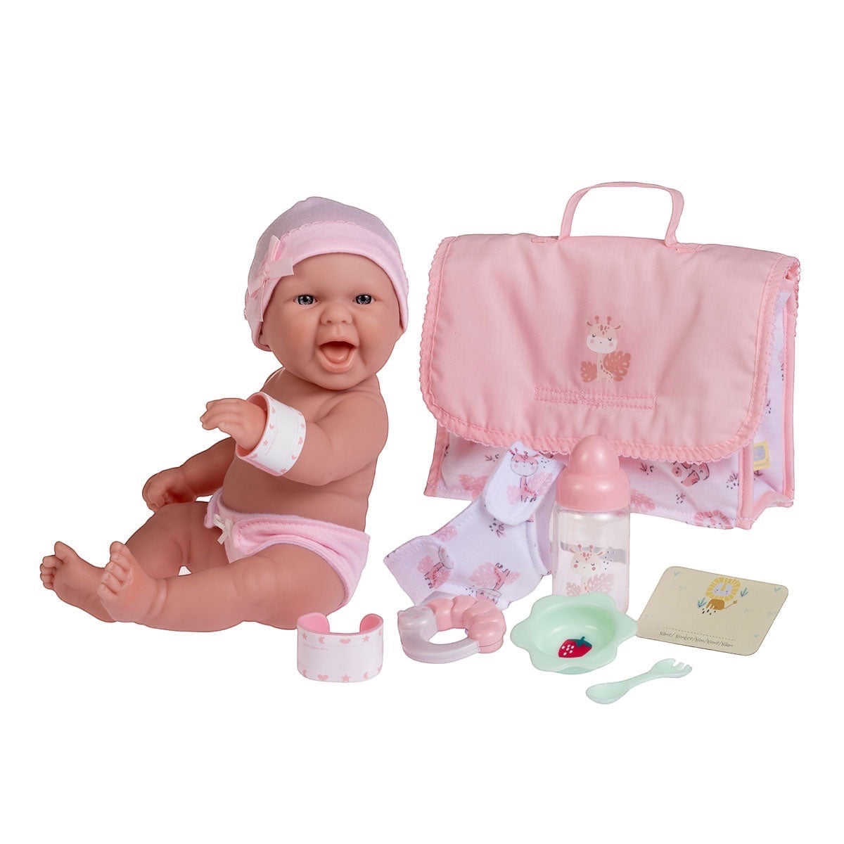 B2B JC Toys USA Baby Doll And Diaper Bag Playset. A baby doll in a pink hat and diaper sits next to a pink diaper bag with giraffe embroidery. Includes bottle, bib, bowl, spoon, fork, teething ring, bracelet, and diaper.