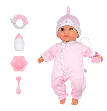 Baby doll in pink outfit with accessories on a white background